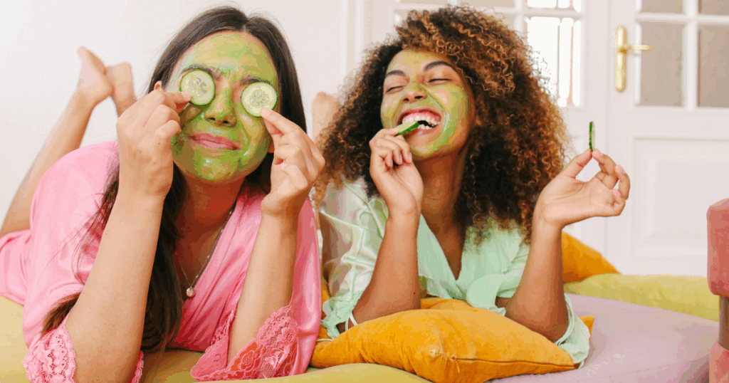 two women with cucumber mask on face practicing self care