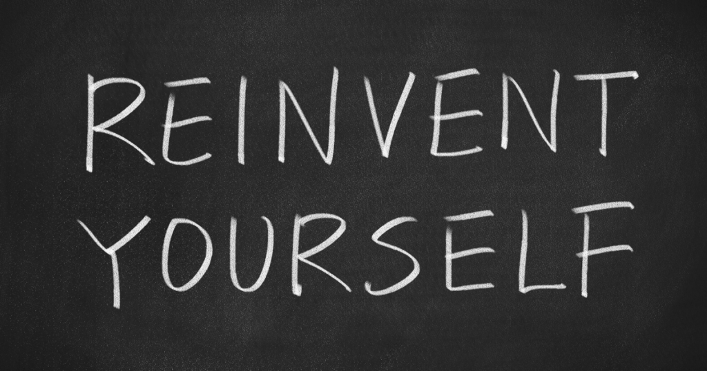 Reinvent yourself in white on black background