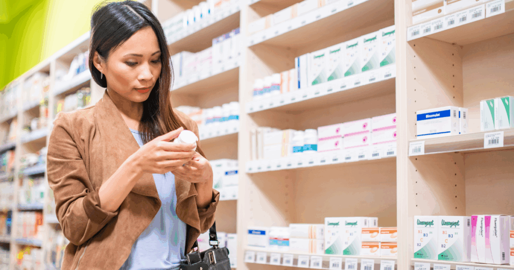 Woman reading a vitamin label with curiosity