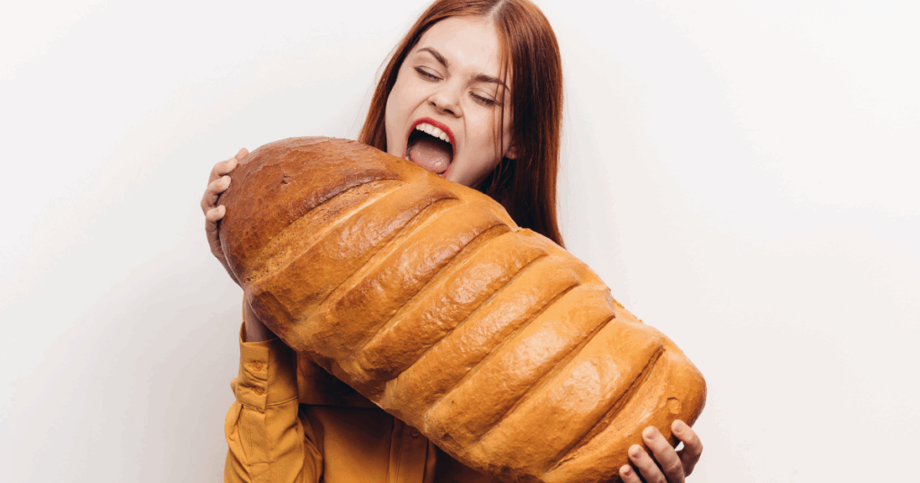 white women with a large loaf of fresh bread